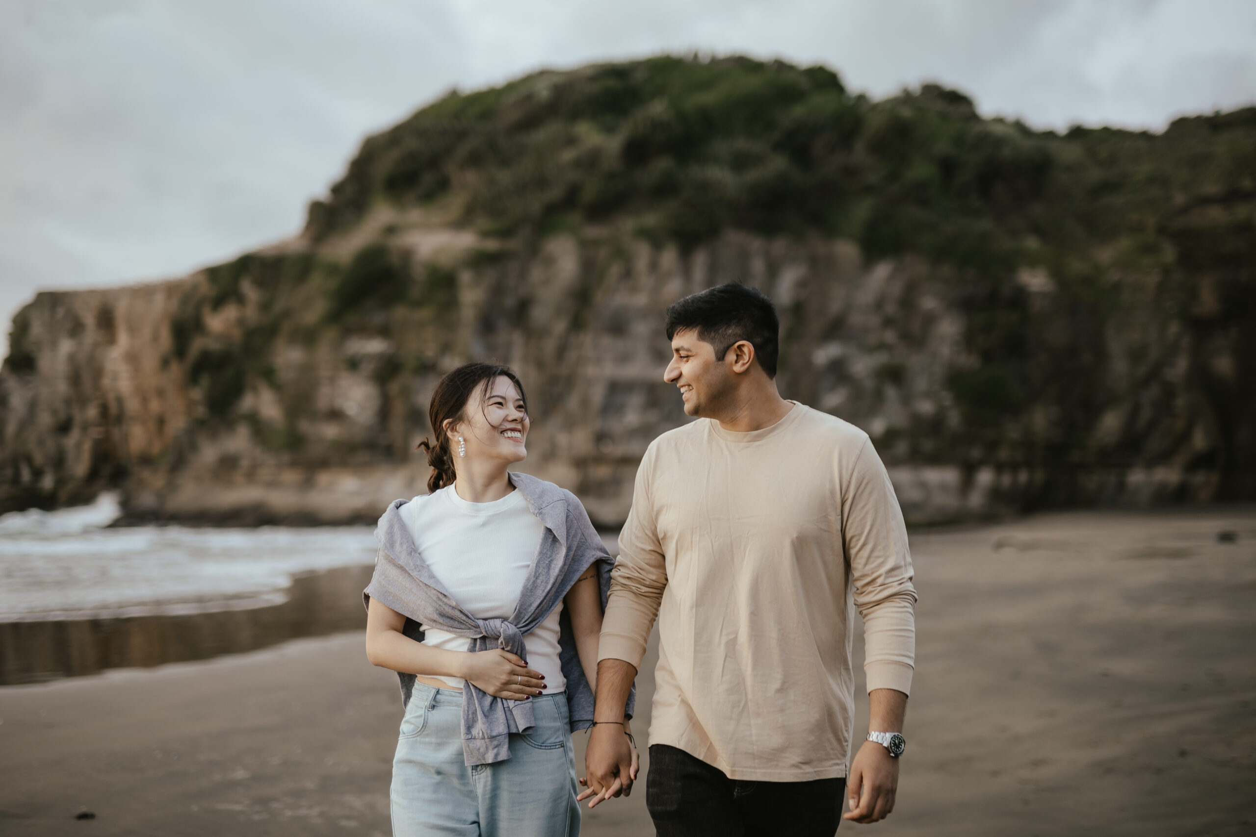 Couple holding hands on a beach